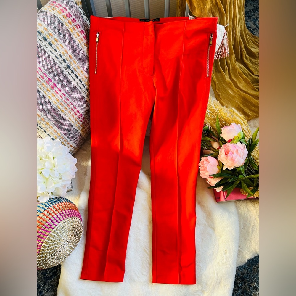 Zara bright orange cigarette pants with faux zipper pockets front and back.